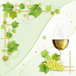 Glass of white wine and grapes