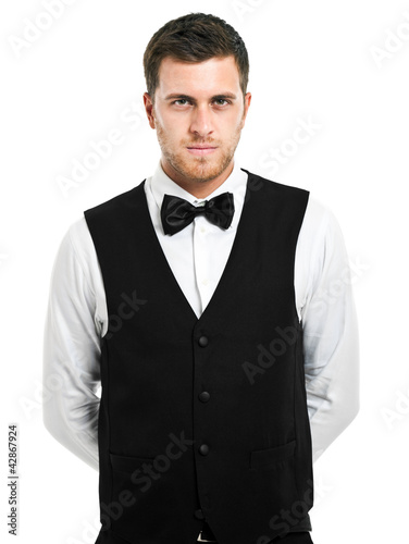 Photo: Handsome waiter isolated on white Handsome waiter isolated on white