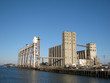 Large old rundown cement factory along the water
