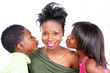 Photo: Smiling mom gets a kiss from loving kids Smiling mom gets a kiss from loving kids