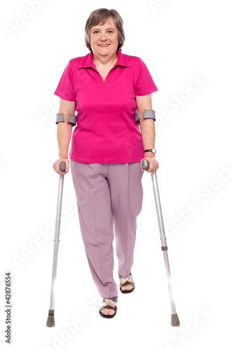 Photo: Full length portrait of an injured senior woman Full length portrait of an injured senior woman