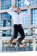 Photo: Happy businessman jumps in the air Happy businessman jumps in the air