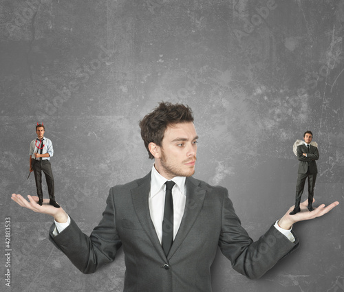 Photo: Businessman with devil or angel Businessman with devil or angel