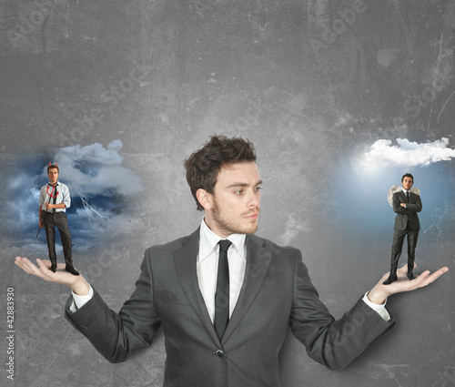 Photo: Businessman with devil or angel Businessman with devil or angel