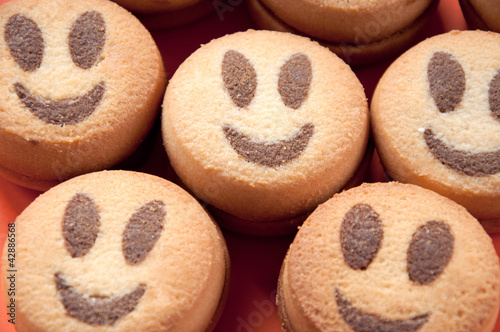 Photo: Close-up of smiling cookies, studio shot Close-up of smiling cookies, studio shot