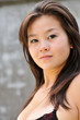 Young asian girl look at camera