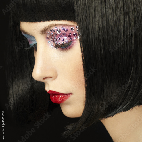 Photo: Fashion photo of young woman with dark hair Fashion photo of young woman with dark hair