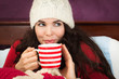 Beautiful woman having hot drink