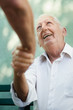 Group of happy elderly men laughing and talking