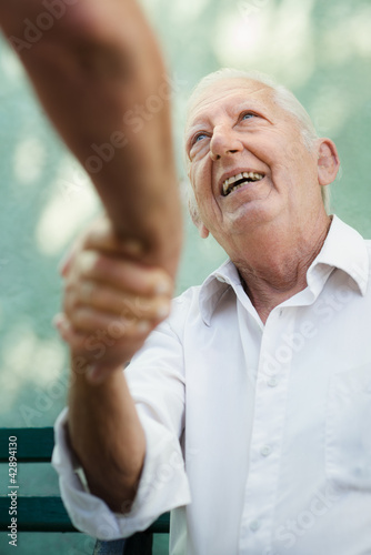 Photo: Group of happy elderly men laughing and talking Group of happy elderly men laughing and talking