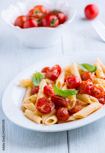 Photo: Penne pasta with cherry tomatoes and basil Penne pasta with cherry tomatoes and basil