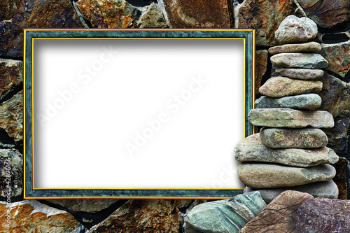 Photo: Frame for a photo with a cairn on a stone background Frame for a photo with a cairn on a stone background