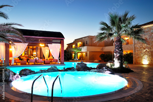 Photo: Outdoor restaurant during sunset at the luxury hotel, Pieria, Gr Outdoor restaurant during sunset at the luxury hotel, Pieria, Gr