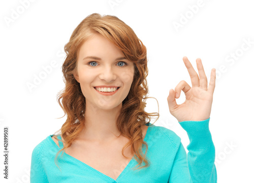 Photo: teenage girl showing ok sign teenage girl showing ok sign