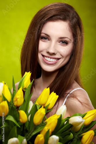 Photo: Beautiful spring woman portrait. green concept Beautiful spring woman portrait. green concept