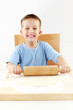 Small boy baking cookies