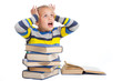 Foto: schoolgirl with horror looking at pile of books schoolgirl with horror looking at pile of books
