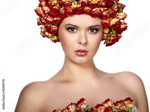 Photo: Portrait of young beautiful woman with rose in hair, on white ba Portrait of young beautiful woman with rose in hair, on white ba