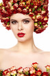 Photo: Portrait of young beautiful woman with roses in hair, on white b Portrait of young beautiful woman with roses in hair, on white b