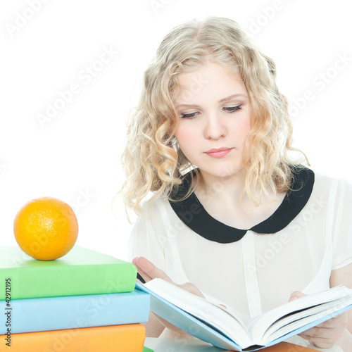 Photo: Blonde teenage girl with a book Blonde teenage girl with a book
