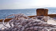 Wooden boat sailing on blue sea