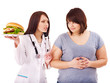 Woman with hamburger and doctor.