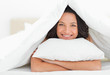 Cute woman hugging a pillow
