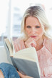 Housewife perusing a book