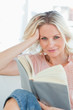 Blonde female with a book
