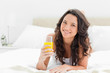 Attractive brunette with an orange juice