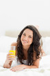 Close-up of an attractive brunette with an orange juice