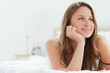 Beautiful woman lying down on a bed