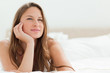 Portrait of a calm woman lying on her bed