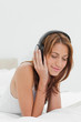Close-up of a redhead enjoying music