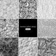 Set of eight black and white wave patterns (seamlessly tiling)
