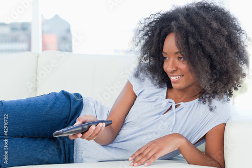 Photo: Close-up of a woman watching television Close-up of a woman watching television