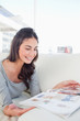 Beaming student reading a magazine