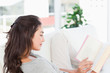 Brunette dipping  into a book