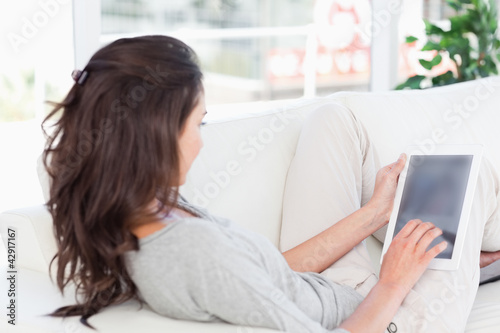 Photo: Brunette using a touchpad Brunette using a touchpad