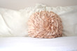 Photo: Pastel peach decorative pillow white sheets in bedroom Pastel peach decorative pillow white sheets in bedroom