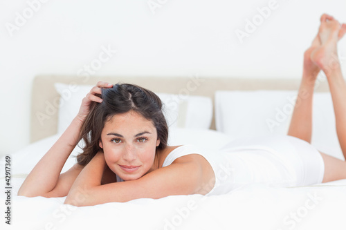 Photo: Portrait of a seductive brunette in her bed Portrait of a seductive brunette in her bed