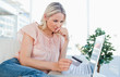 Blonde thinking to shop online