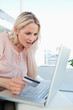 Blonde surprised about a shop online