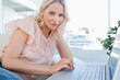 Portrait of a blonde on a laptop