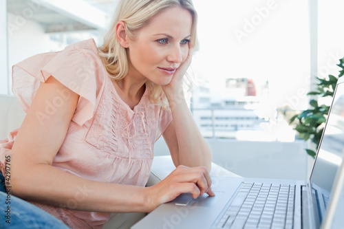 Photo: Blonde on a laptop Blonde on a laptop