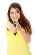 Happy beautiful girl is shooting with a slingshot.