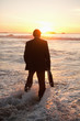 Young businessman walking in the water