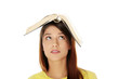Student girl with book on the head.