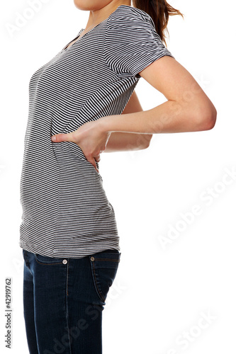 Photo: Woman is showing backache. Woman is showing backache.