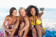 Three friends happily posing for a photo